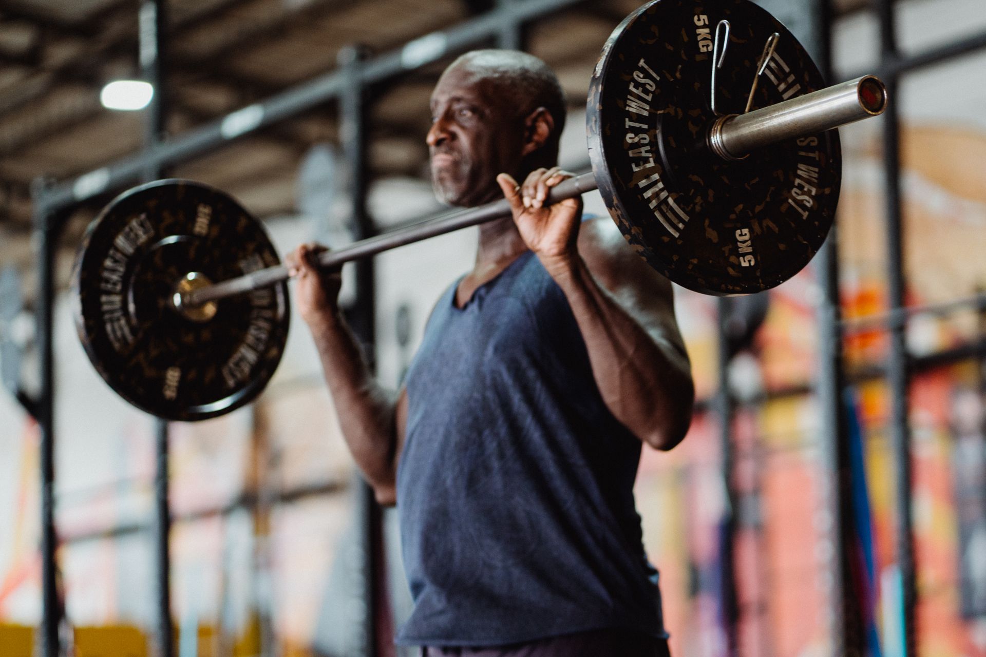 Athlete lifting a heavy barbell to progress their strength