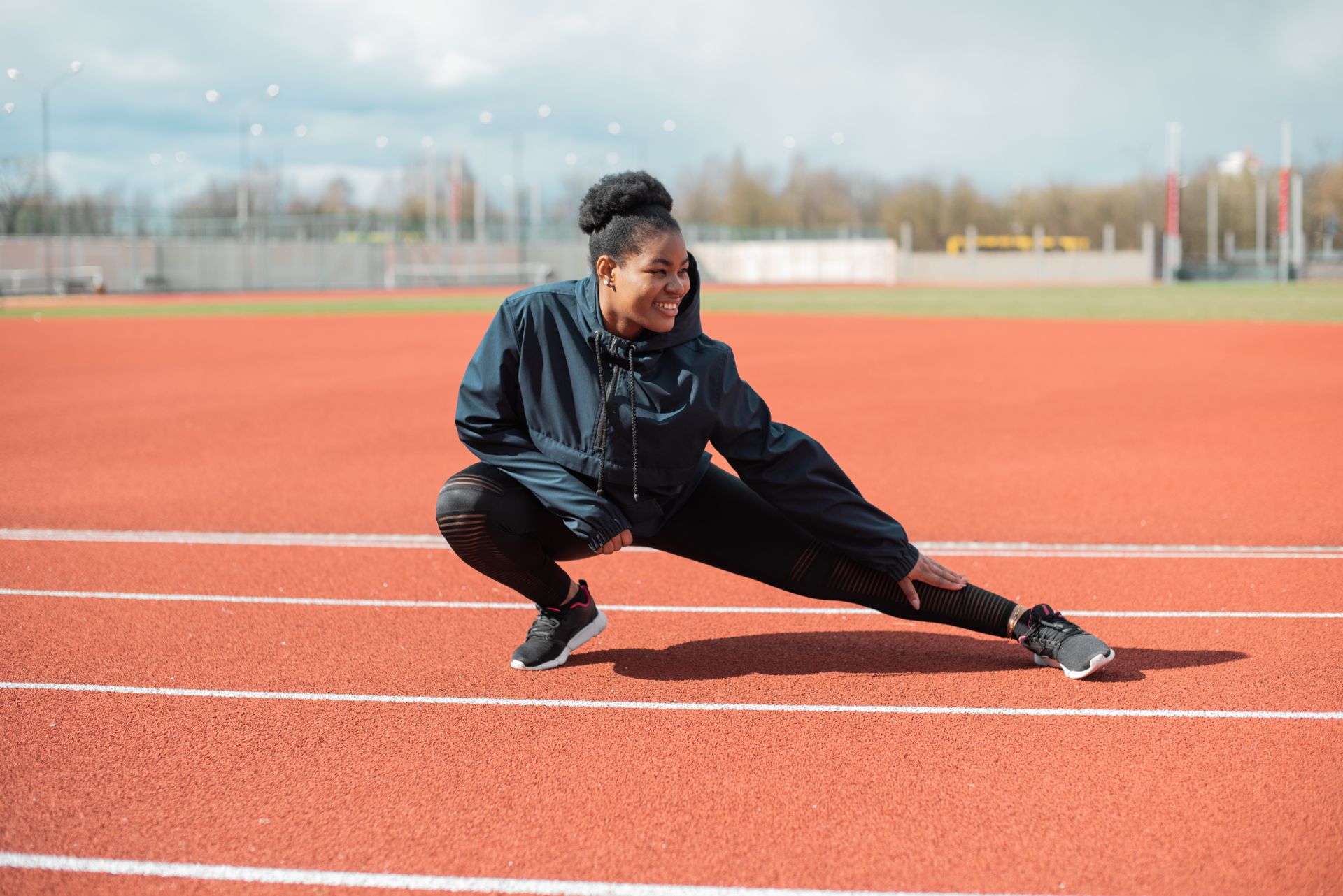 Athlete stretching to warm up and prevent injury